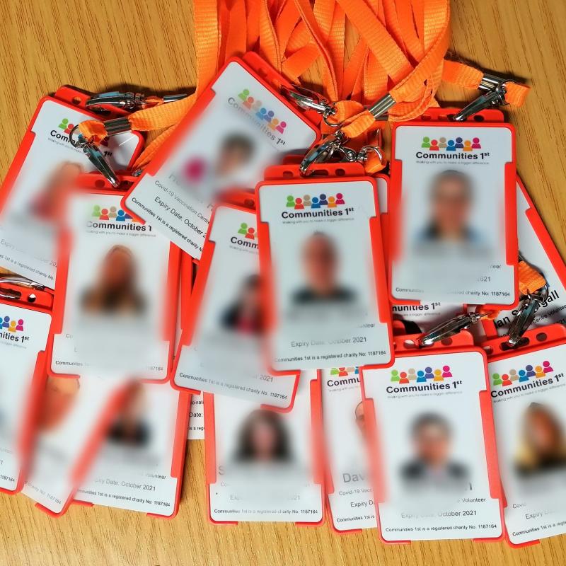 A group of ID badges and lanyards