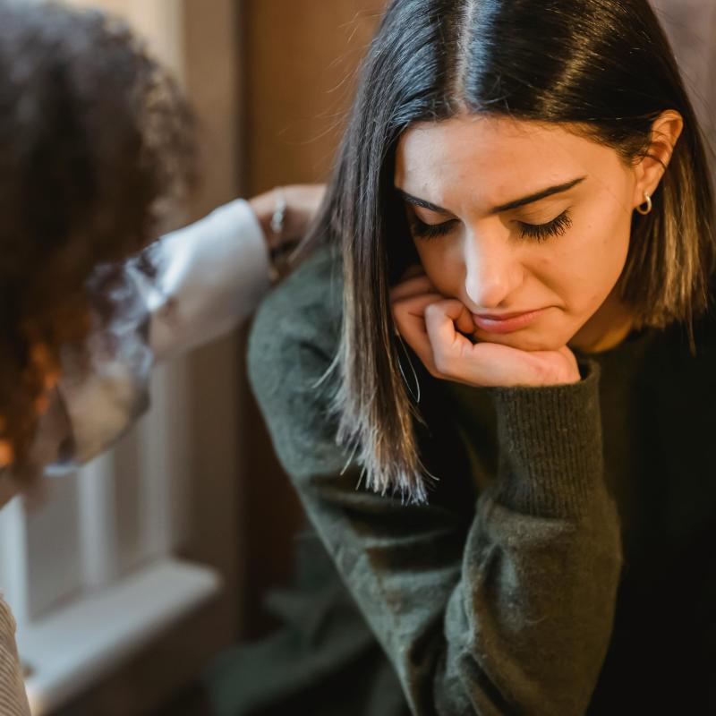 https://www.pexels.com/photo/crop-woman-tapping-shoulder-of-frustrated-female-friend-6383158/