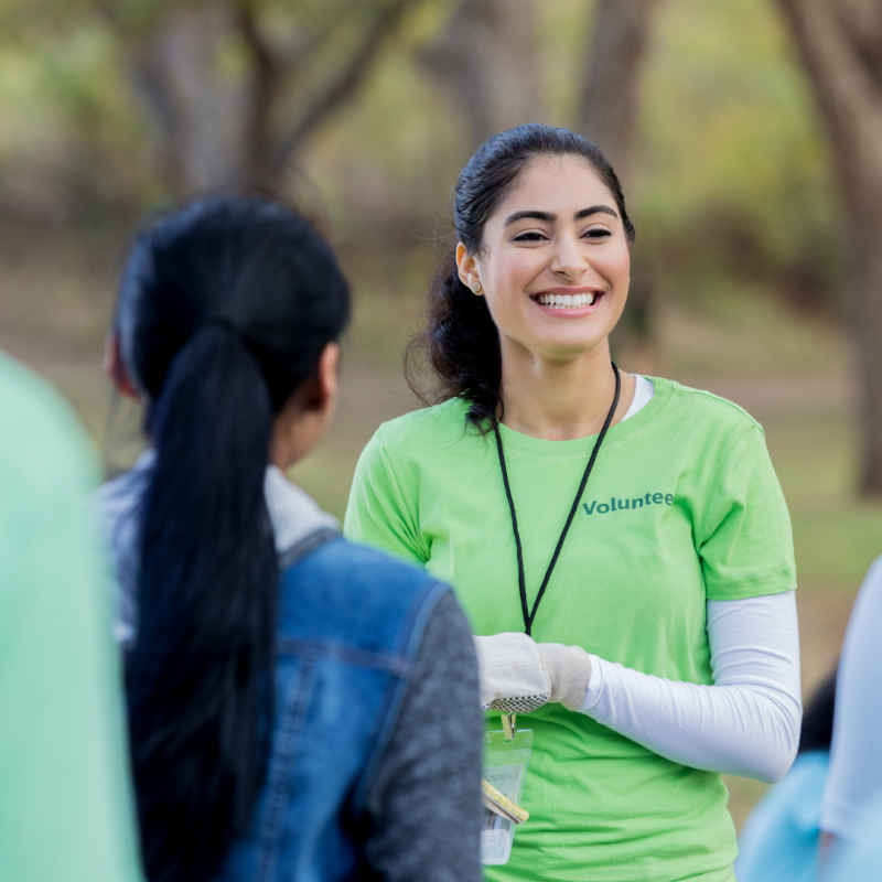 A smiling volunteer coordinator