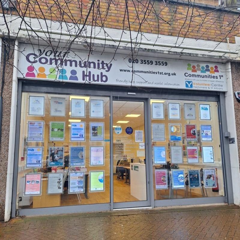 The front of the Community Hub Borehamwood with view of the space and welcoming smiles from inside
